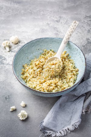 Roasted  organic cauliflower rice with herbs - paleo and ketogenic diet concept
