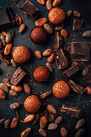 Photo for Homemade sweetmeats with chocolate bars and cocoa beans - Royalty Free Image