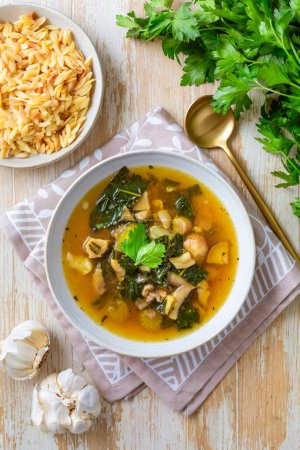 Photo for Homemade miso mushroom soup with vegetable and kale - Royalty Free Image