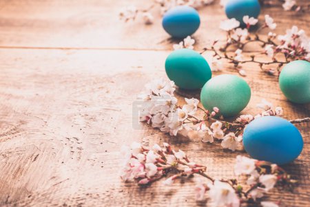 Photo for Easter background with colorful eggs in nest on  wooden background - Royalty Free Image