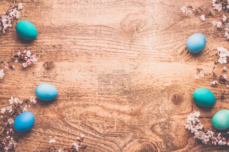 Photo for Easter background with colorful eggs in nest on  wooden background - Royalty Free Image