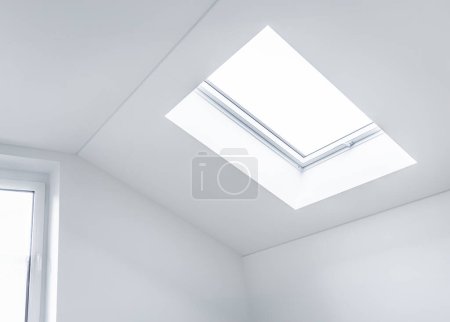 Photo for Loft refurbishment - empty room with skylight ready for renovation - Royalty Free Image