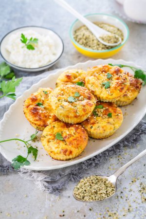 Photo for Homemade egg and zucchini muffins with feta cheese, savory courgette with ingredients - Royalty Free Image