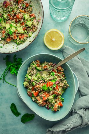 Photo for Tabbouleh salad. Fresh homemade Tabouli salad with fresh parsley, onions, tomatoes and hempseeds. - Royalty Free Image