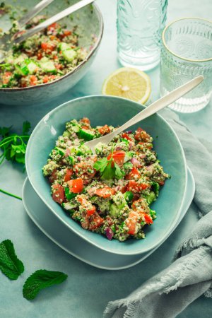 Photo for Tabbouleh salad. Fresh homemade Tabouli salad with fresh parsley, onions, tomatoes and hempseeds. - Royalty Free Image