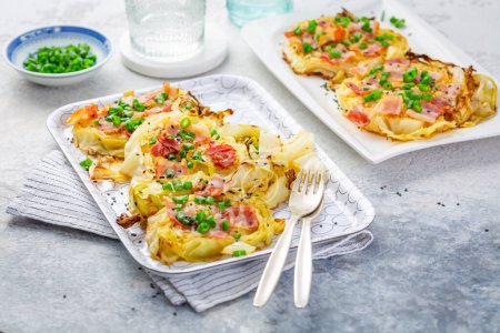 Oven baked cabbage steaks with parmesan, bacon and green onions