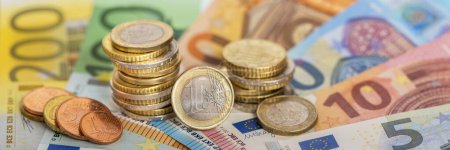 Business, finance and economy with Euro coins and banknotes
