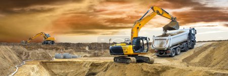 Photo for Excavator ist digging and working at construction site - Royalty Free Image