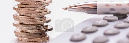 Photo for Finance, business and economy with calculator and Euro coins - Royalty Free Image