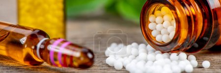 Photo for Alternative medicine and care with herbal pills and acupuncture - Royalty Free Image