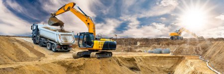 Photo for Excavator ist digging and working at construction site - Royalty Free Image