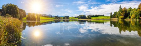Photo for Panoramic landscape with lake at springtime in front of mountain range - Royalty Free Image