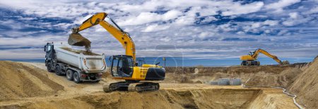 Photo for Excavator is in work and digging at construction site - Royalty Free Image