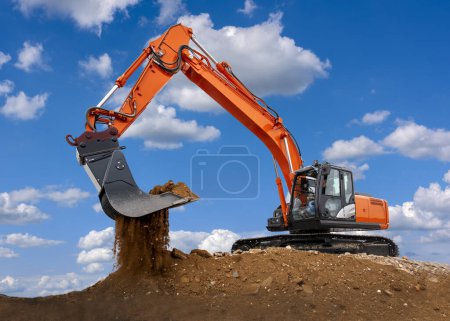 Photo for Excavator is in work and digging at construction site - Royalty Free Image