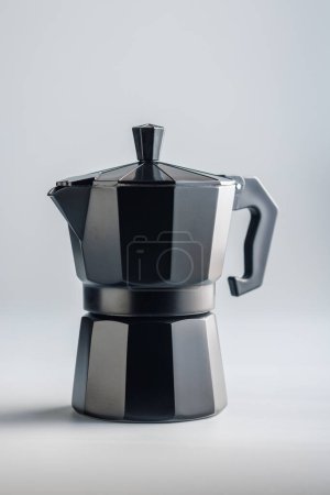 Bialetti moka pot. Coffee maker on the gray background.