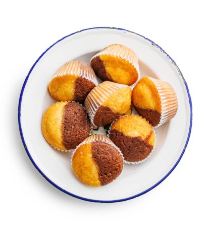 Close Up of a Muffins on plate isolated on a white background.