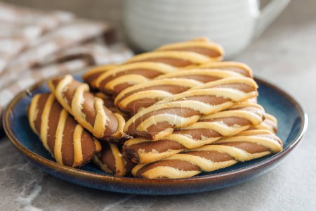 Classic Striped Cookies on plate on a kitchen table.