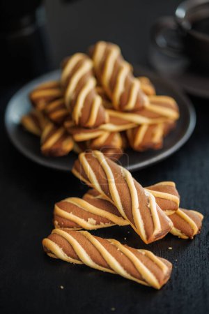 Classic Striped Cookies on a black table.
