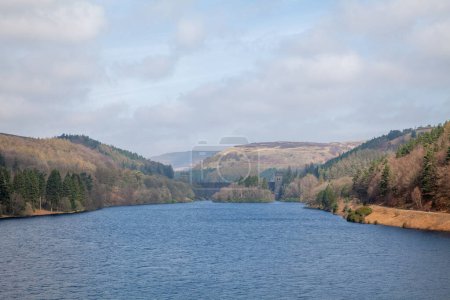 Photo for Ladybower reservoir and Derwent Dam in the Peak District in Derbyshire with blue sky and white clouds - Royalty Free Image