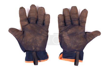 Photo for Dirty worn gardening gloves isolated on a white background. Muddy ripped torn and well used safety pair of gloves. - Royalty Free Image