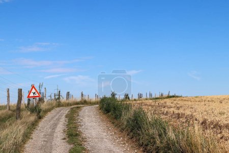 Photo for Airplanes have priority - image of a dirt road with a traffic sign giving priority to airplanes - Royalty Free Image