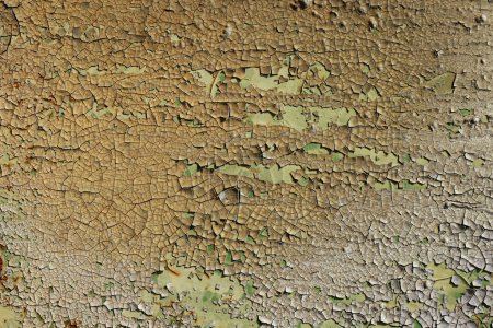 Detail of the flaking paint from the used metal surface