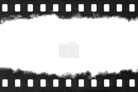 Tattered celluloid filmstrip with natural rough dust and scratches. Retro grunge background.