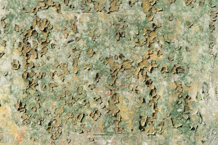 Peeling paint from a concrete wall, grunge texture