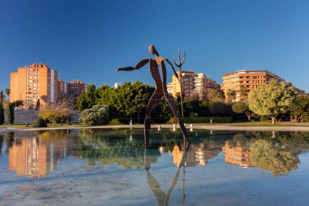 Photo for Valencia, Spain - January 21, 2023: Beautiful scenery of Turia public park with ethe scrupture at dawn in Valencia, Spain - Royalty Free Image