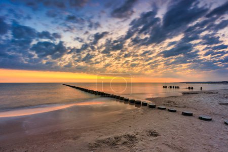 Beautiful sunrise on the summer beach at Baltic Sea in Ustka, Poland.