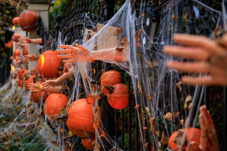 Photo for Scary Halloween decorations on the fence. Poland - Royalty Free Image