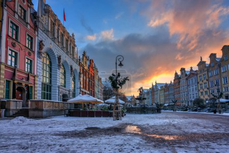 Photo for Sunrise in the historic center of Gdansk with the Neptune fountain at winter, Poland. - Royalty Free Image