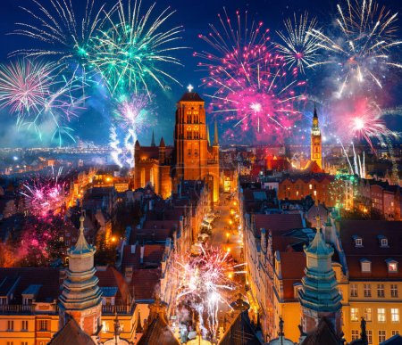 Photo for New Year fireworks display over the main town of Gdansk. Poland - Royalty Free Image