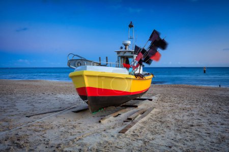 Photo for Fishing boats on the beach of Baltic Sea in Sopot at dawn, Poland - Royalty Free Image