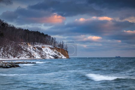 Photo for Winter landscape of Baltic Sea coast in Gdynia Orlowo at sunrise, Baltic Sea. Poland - Royalty Free Image