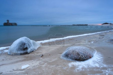 Frozen Baltic Sea beach in Babie Doly at sunset, Gdynia. Poland