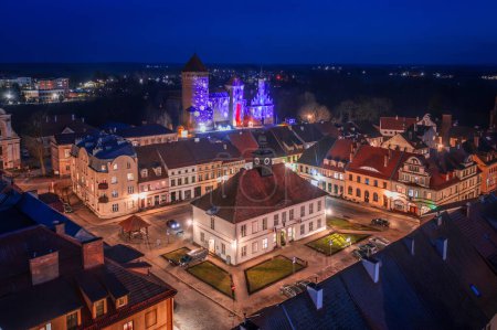 Photo for The Teutonic castle in Reszel in Warmia illuminated at dusk, Poland. - Royalty Free Image