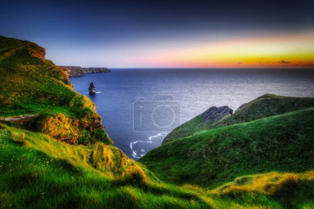 Photo for Cliffs of Moher at sunset in Co. Clare, Ireland. - Royalty Free Image
