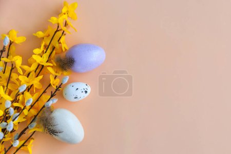Photo for Composition of flowers, bunnies and Easter eggs on a pastel background - Royalty Free Image