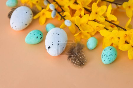 Photo for Composition of flowers and Easter eggs on a pastel background - Royalty Free Image