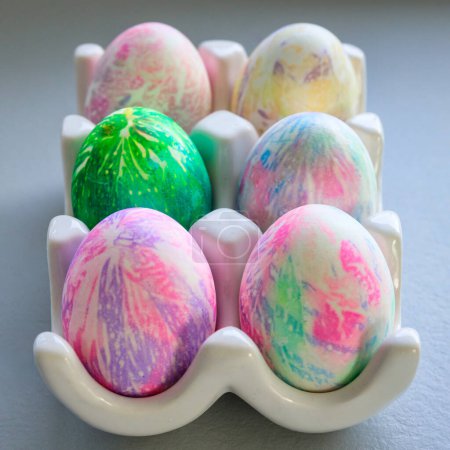 Photo for Composition of bunnies and Easter eggs on a gray background - Royalty Free Image