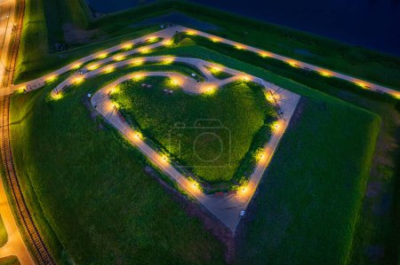 Photo for Bison bastion, 17th-century fortifications of Gdansk illuminated at night in the heart shape. Poland - Royalty Free Image