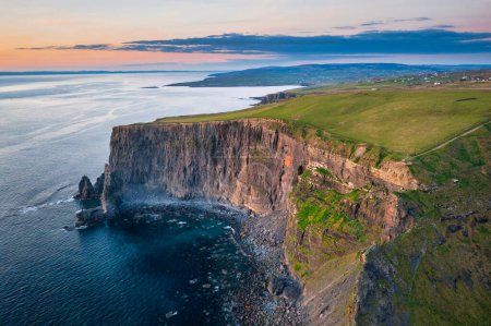 Aerial landscape with the Cliffs of Moher in County Clare at sunset, Ireland.