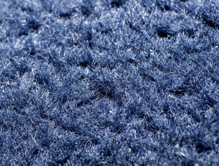 Texture of blue knitted fabric as background.
