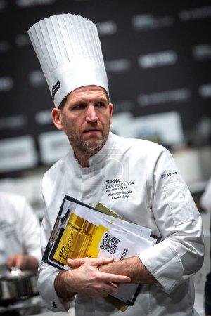 Photo for Lyon, Rhone Alpes Auvergne, France  january 22, 2023 : BOCUSE D'OR Lyon Eurexpo Sirha event 2023. The famous french chef Alexandre Mazzia portrait with sirha document. He is the jury member for the Bocuse d'or competition of the elite cookers in the - Royalty Free Image