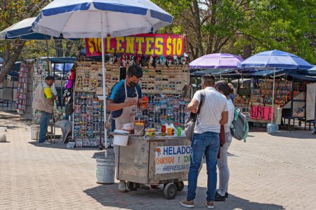 Foto de MEXICO CITY, MEXICO. March 24, 2022: Treats stand with batanas, chips, maxican snacks n Chapultepec park, Mexico City, Mexico, - Imagen libre de derechos