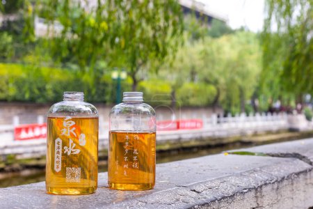 Photo for Jinan, Shandong, China -  29 June 2023:  Street drink tea from the fresh sptrings water in The town park of pound water, the famous "Black Tiger Spring" in Jinan. - Royalty Free Image