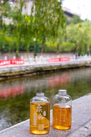 Photo for Jinan, Shandong, China -  29 June 2023:  Street drink tea from the fresh sptrings water in The town park of pound water, the famous "Black Tiger Spring" in Jinan. - Royalty Free Image