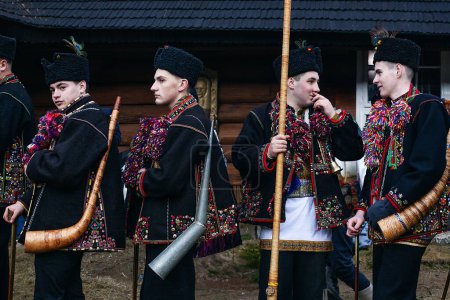 Photo for Kryvorivnya, Ukraine - January 6, 2024: Gutsuls (highlanders in Carpathian mountains) are singing Christmas Carols (Kolyadki)  in Kryvorivnya, Ukraine. - Royalty Free Image
