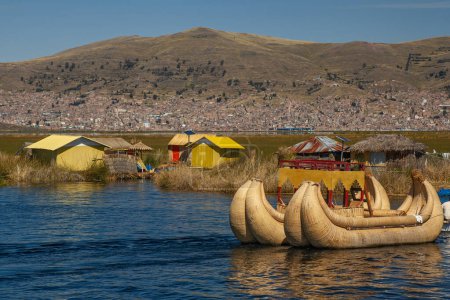 Photo for Tourist boats made of reed moored at Uros Islands, Lake Titicaca, Peru - Royalty Free Image